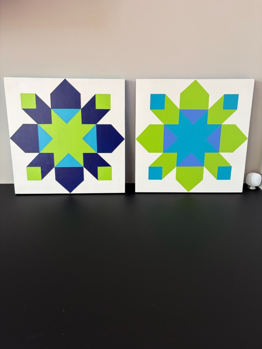 Pair of Two Geometric Starbursts on Wood Panel in Lime Green, Blue, and Teal